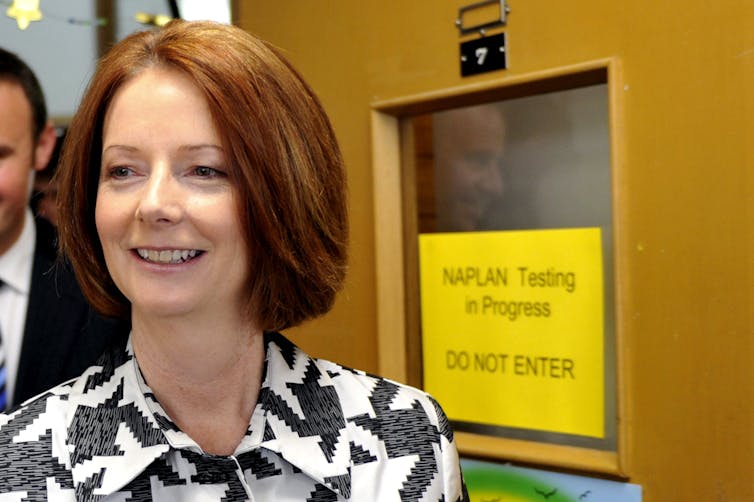 Julia Gillard in front of room where NAPLAN tests are in progress.