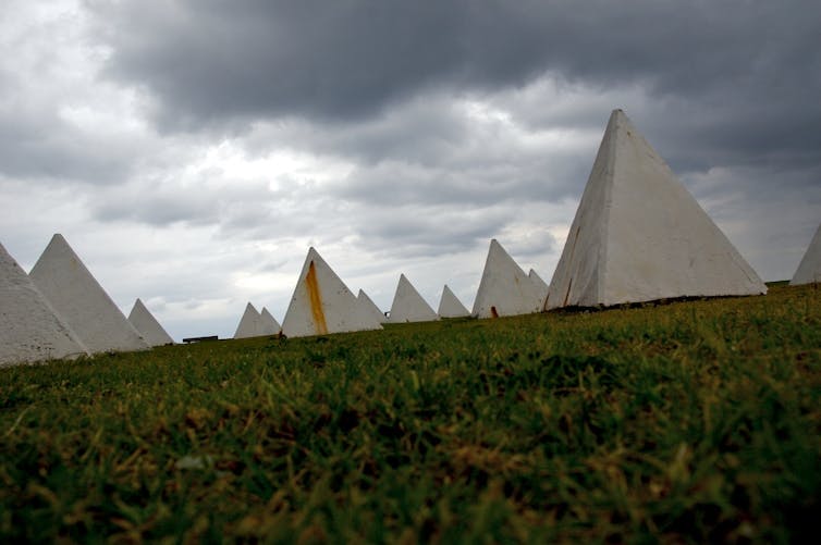 Small concrete pyramids designed to stop tanks.
