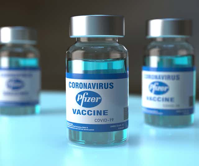 Three vials of Pfizer COVID vaccine