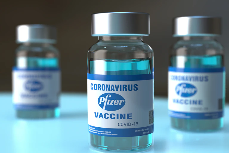 Three vials of Pfizer COVID vaccine