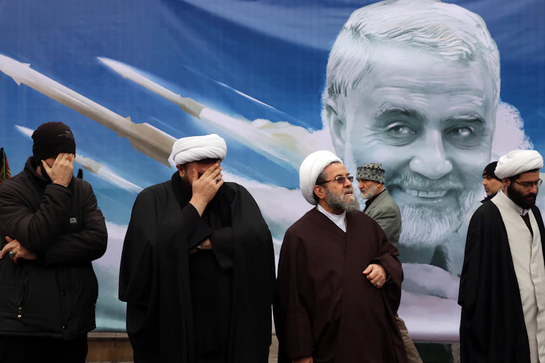 Four senior Iranian clerics in front of a poster depicting general Qasem Soleimani was was assassinated in Iraq in 2018.
