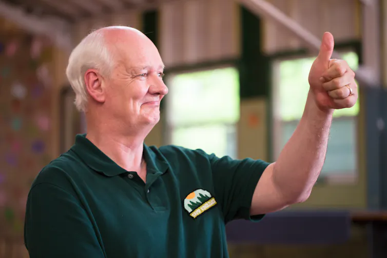 A man doing a thumbs up.