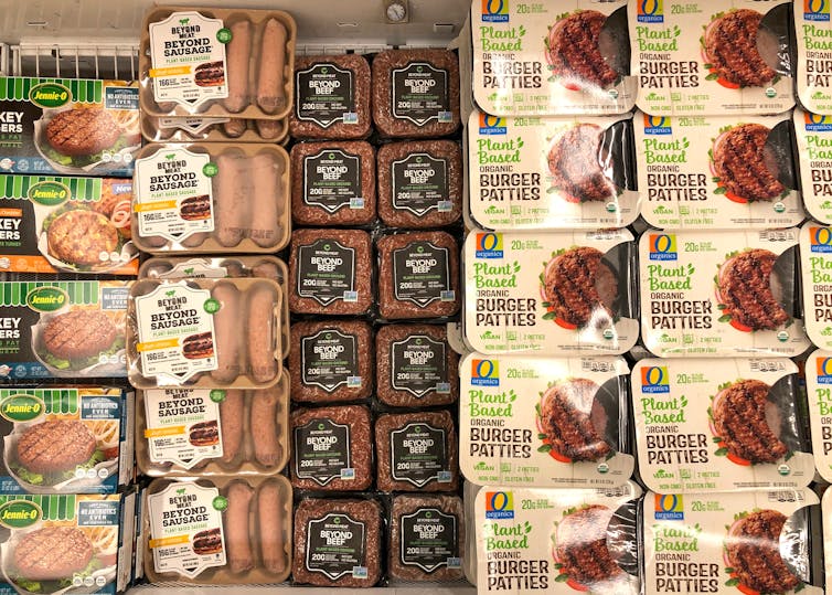 Packages of plant-based meat products in a freezer.