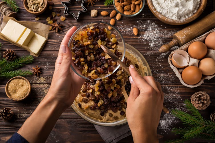 A woman making a Christmas cake