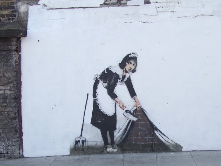 Sweeper, by Banksy, Chalk Farm Road, Londres, 2007.