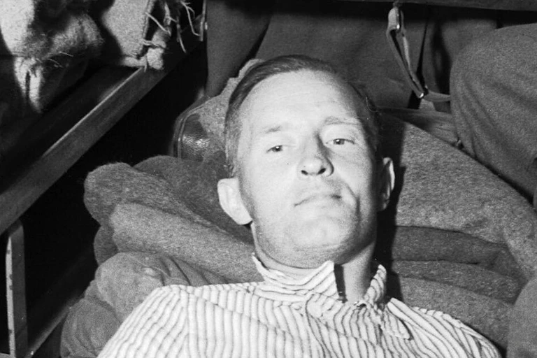 Middle aged man lying on a stretcher