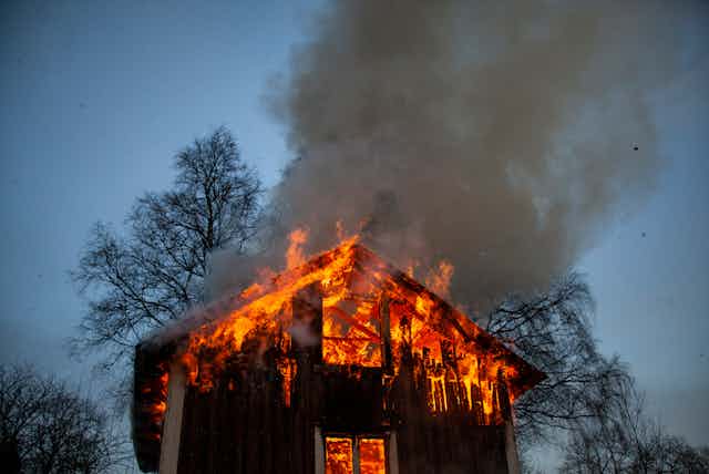 A house burns.