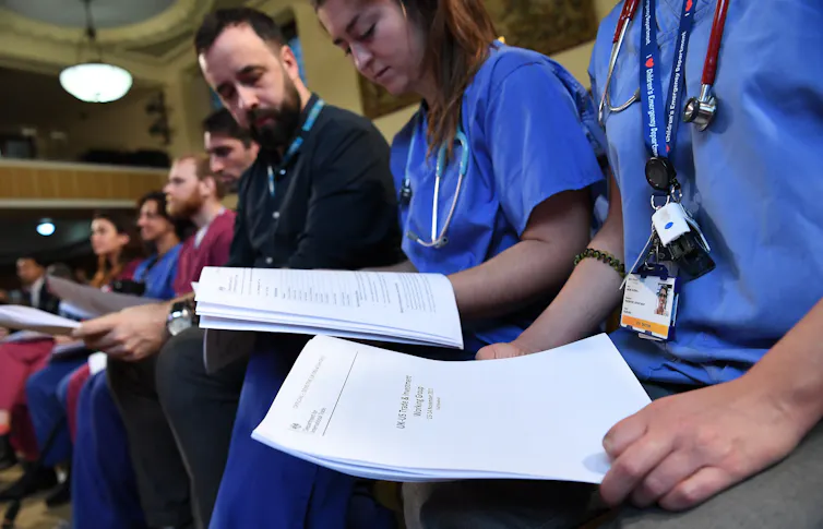 NHS staff with unredacted documents of secret talks between the US and UK governments, 27 November 2019