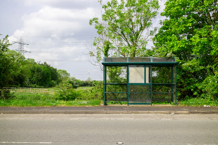 Empty bus stop on country lane