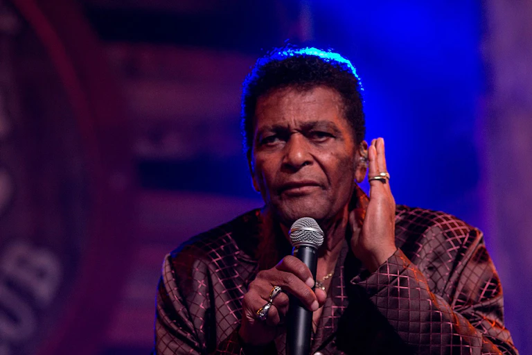 Country star Charley Pride singingin.