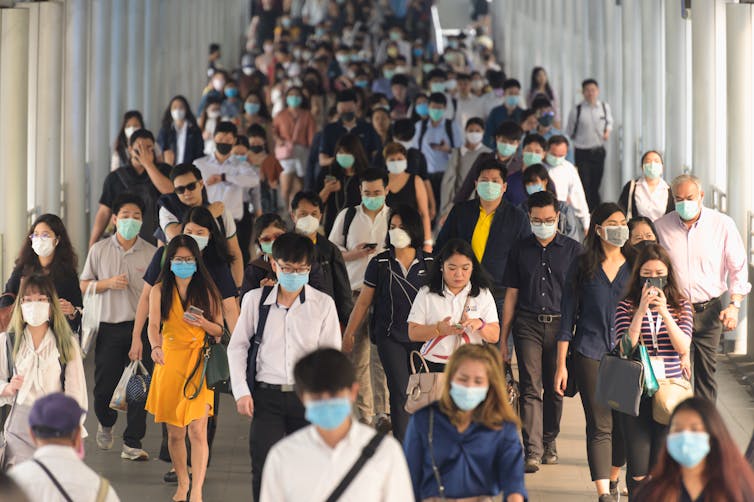 Lots of people in public wearing masks.