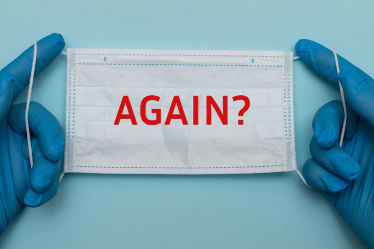 Hands holding mask with the word "again?"