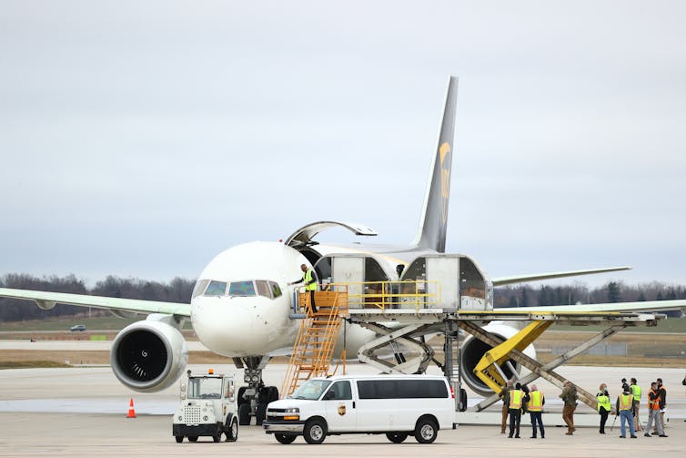 Covid-19 vaccine is loaded on to airplane.