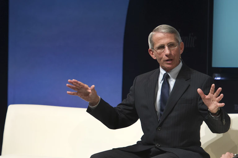 Fauci seats speaking onstage