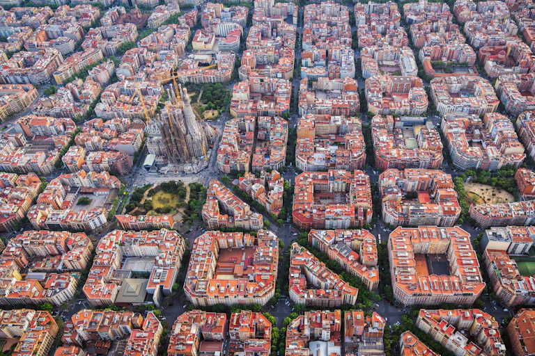 Aerial view of regular city blocks and basilica.