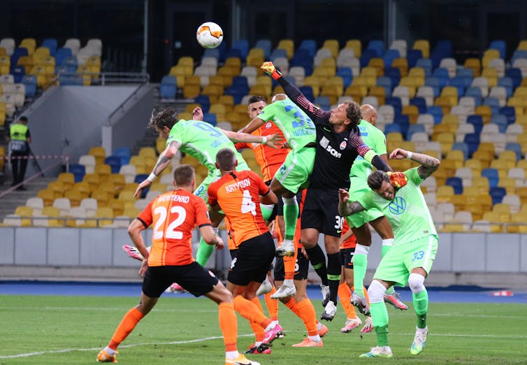 VfL Wolfsburg (in green) during a match