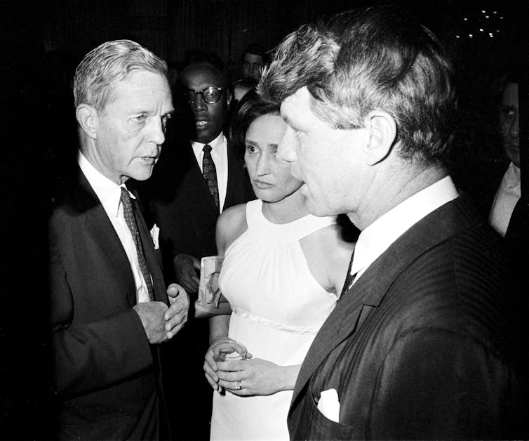 A 1967 photo shows U.S. Sen. Joseph Clark of Pennsylvania talking with fellow Sen. Robert Kennedy of New York.