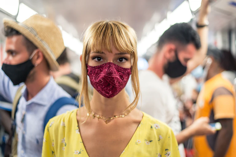 Woman wearing cloth mask on public transport