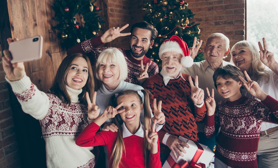 A family posing for a Christmas selfie