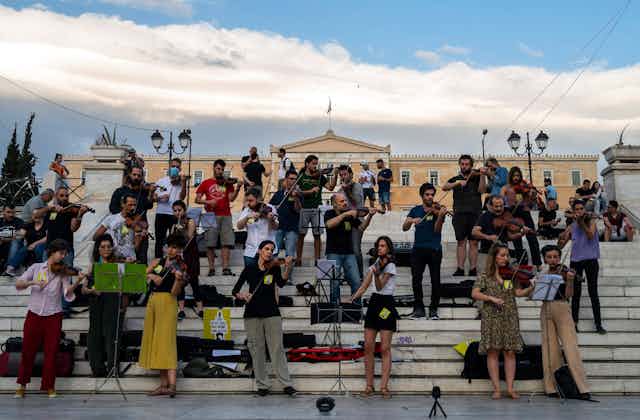 A group of Greek musicians staging a musical protest outside the Greek parliament in Athens.