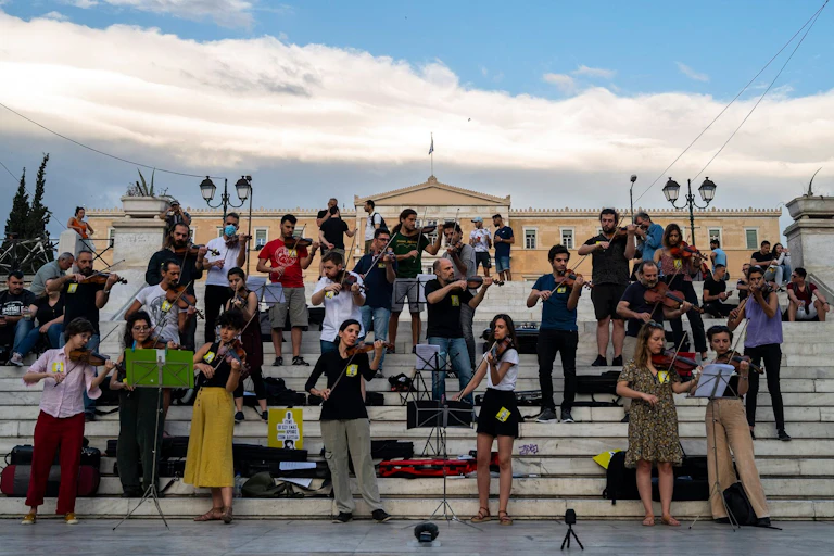 A group of Greek musicians staging a musical protest outside the Greek parliament in Athens.