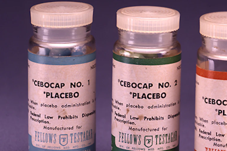 Three bottles containing placebos.