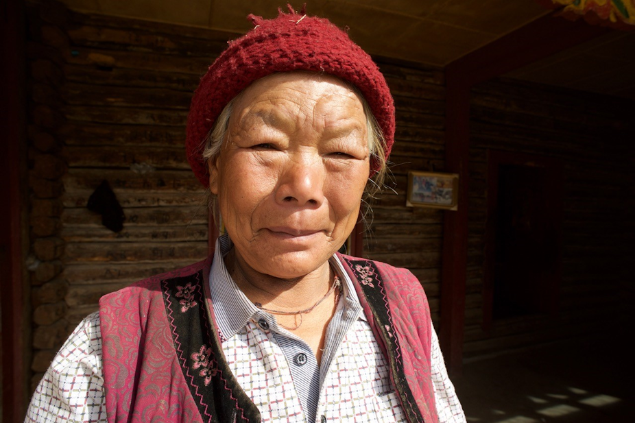 A Mosuo woman looking at the camera.