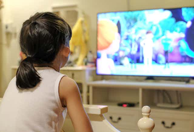 A child watching cartoons on tv