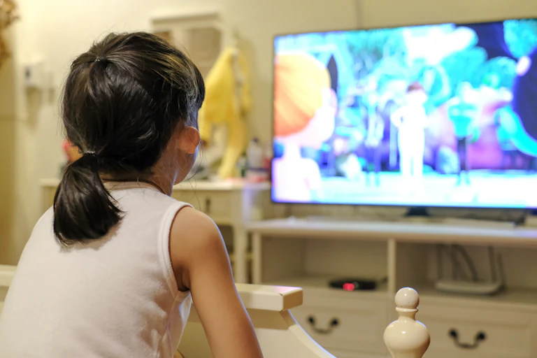 A child watching cartoons on tv