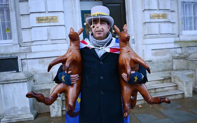 Pro-EU protester mocks the Prime Minister Boris Johnson's 'Australian Deal' outside the Cabinet Office in London, Britain.