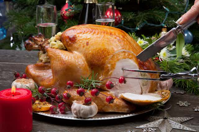 A Christmas turkey being carved.