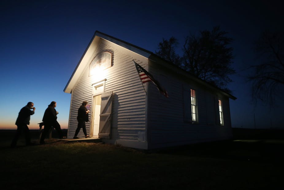Voters enter a polling place at dusk to cast their ballots at Sherman Township Hall, a former one room schoolhouse, on November 3, 2020 in Zearing, Iowa.