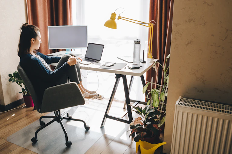 Woman working at home. telework on laptop