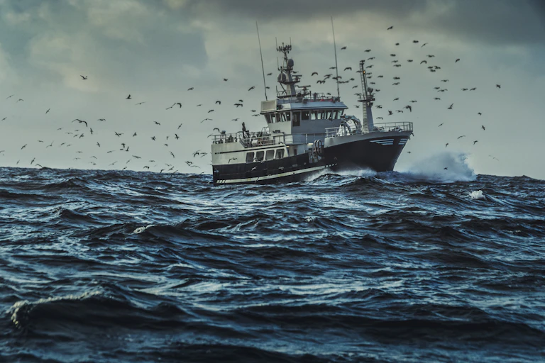 A commercial fishing boat on the open ocean.