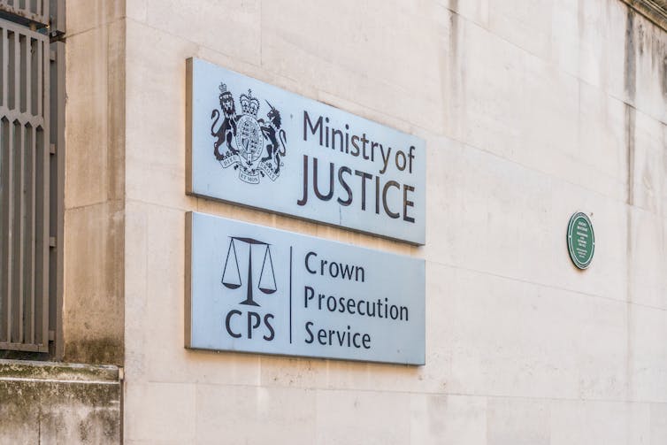 Ministry of Justice sign and Crown Prosecution Service sign on a building