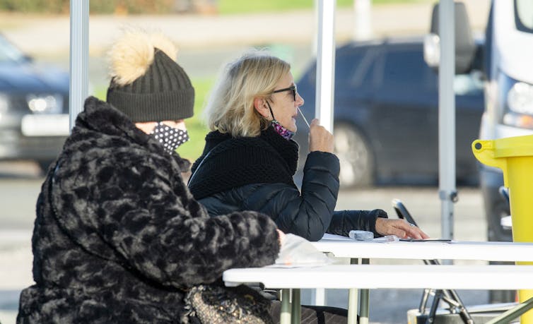 Members of the public being swabbed during mass testing in Liverpool