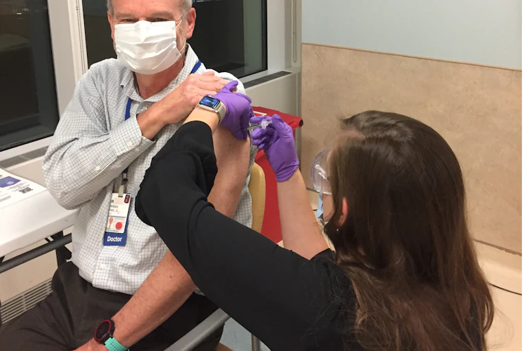 William Petri getting vaccinated.