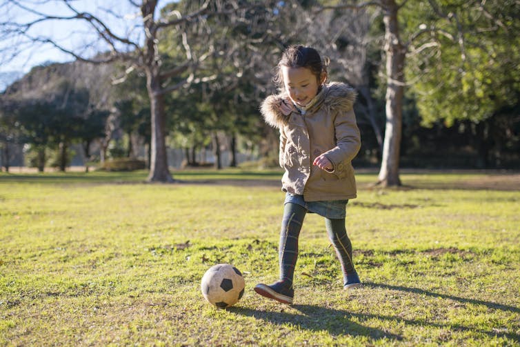 Girl with soccer ball.