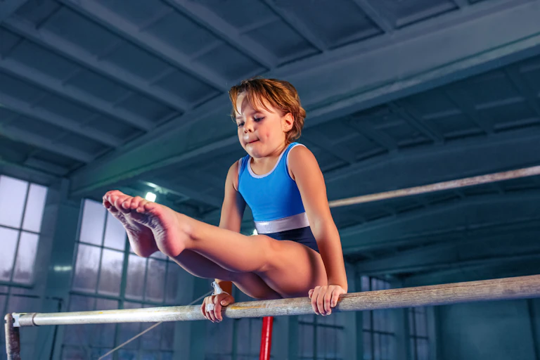 A young girl practicing her gymnastics.