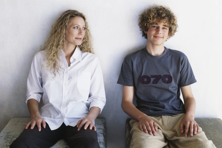 woman looks at teen