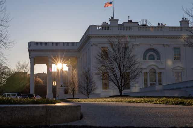 sunrise seen through the White House portico