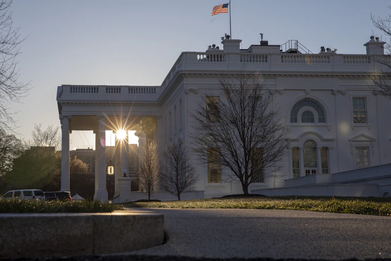 sunrise seen through the White House portico