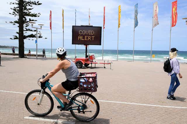 A sign near a Sydney beach says 'COVID Alert'.