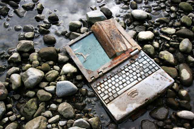 Discarded laptop on the ground