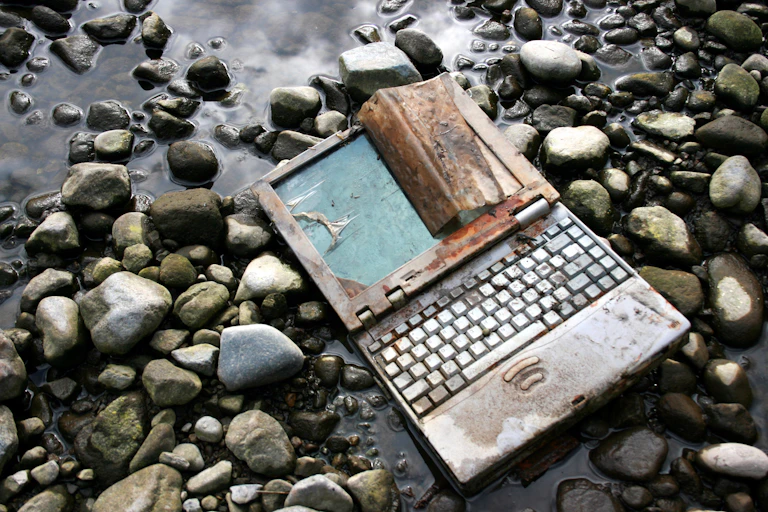 Discarded laptop on the ground