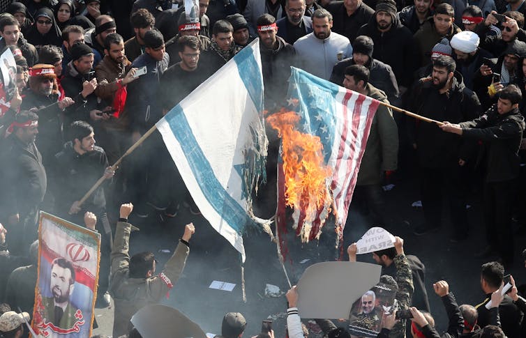Iranians burn US and Israel flags 