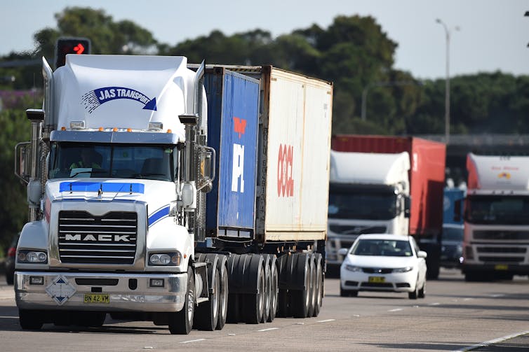 Trucks bunched up on multilane highway