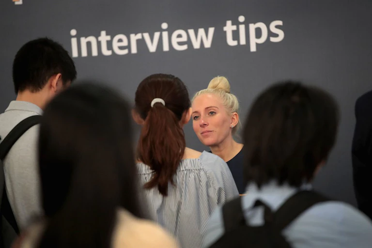 Job seekers get tips at a career fair in Chicago