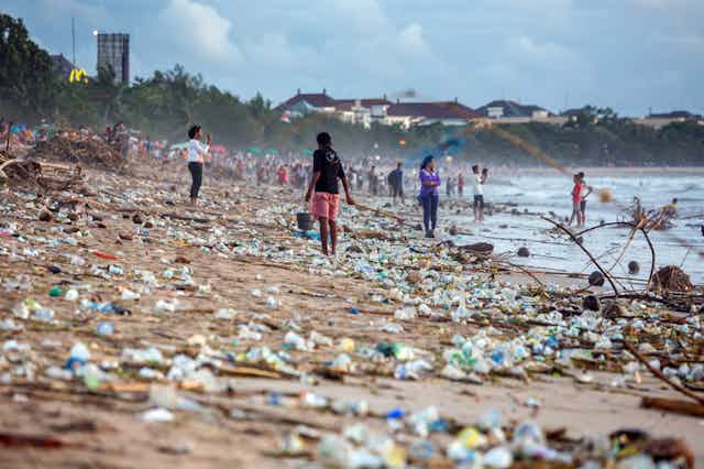 Plastic bottles strewn over a beach in Bali in 2017