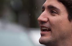 Justin Trudeau smiles in profile.